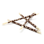 decorative chocolate pencil made of high-quality white and dark chocolate combined to create an abstract pattern.